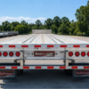 Reitnouer MaxMiser aluminum flatbed trailer rear deck with sliding axle setup