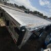 Used 2024 Reitnouer DropMiser step deck with two toolboxes and loading ramps. Unit 65316, priced at $62,500.